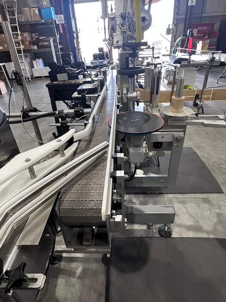 Inline Filling Systems Complete Used Bottling & Labeling Line for Spirits (GNS 80 Proof Vodka) – Labeler, Filler, Capper, Conveyor, Heat Tunnel, Turntables & More – C1D2 Hazardous Location Rated, 2024 - Image 11